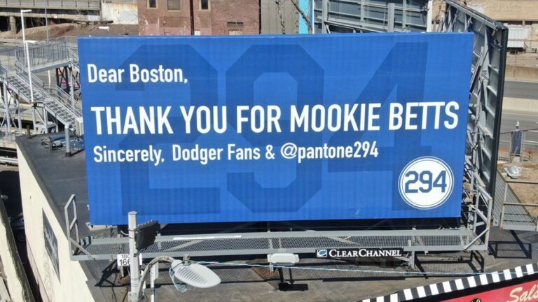 Los Angeles Dodgers fans buy sign at Fenway Park thanking Boston Red Sox for Mookie Betts trade